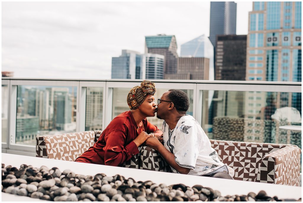 Black couple at engagement session at pike place market in downtown seattle, captured by candace photography