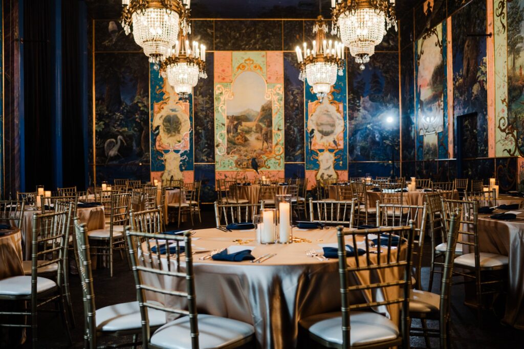 Wedding reception details at The Ruins in Seattle featuring moody lighting and historic character