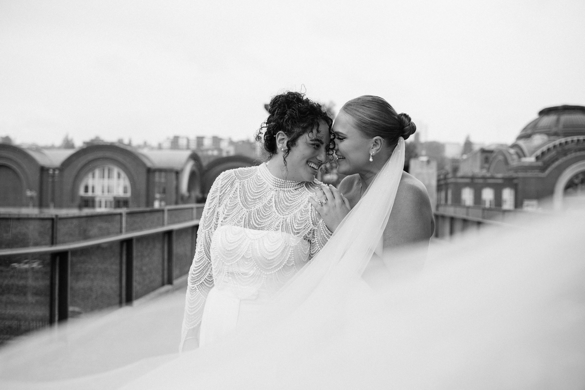 Brides Embracing on Walk to Wedding Venue in Tacoma