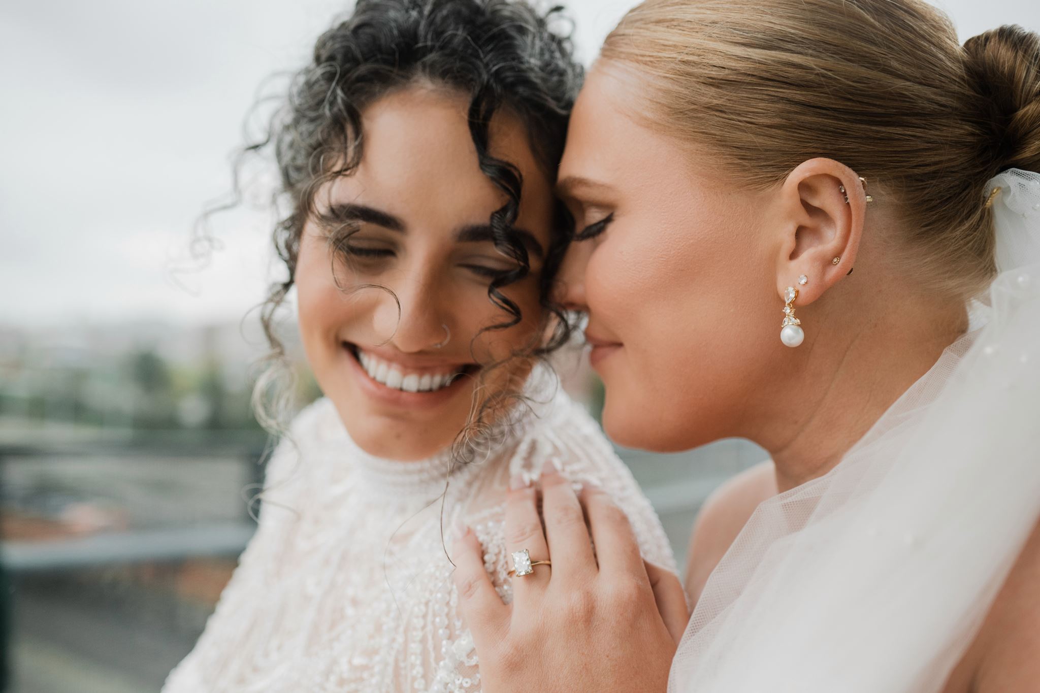 Brides Embracing During Tacoma Wedding
