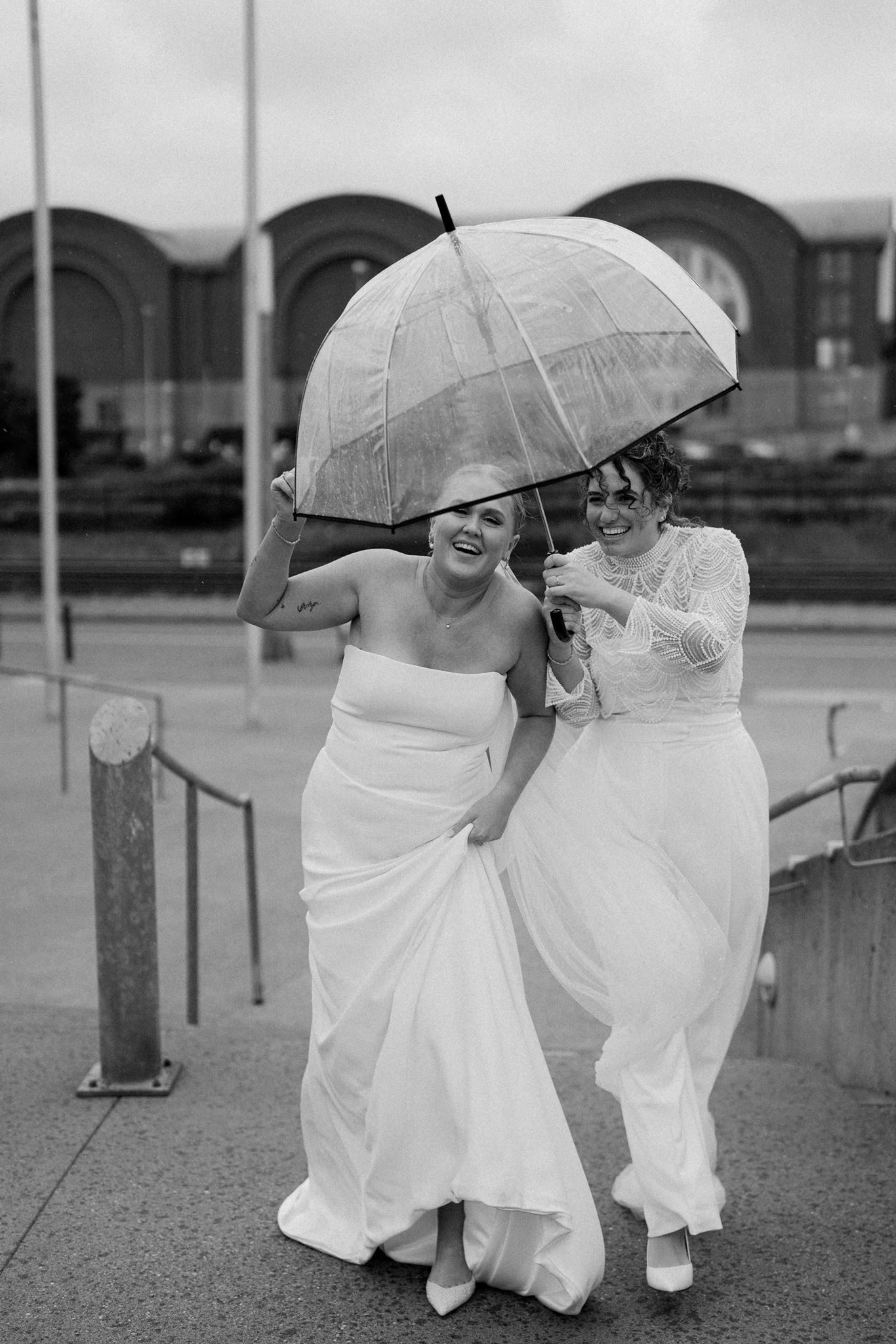 Brides Holding Clear Umbrella During Rain, PNW Wedding