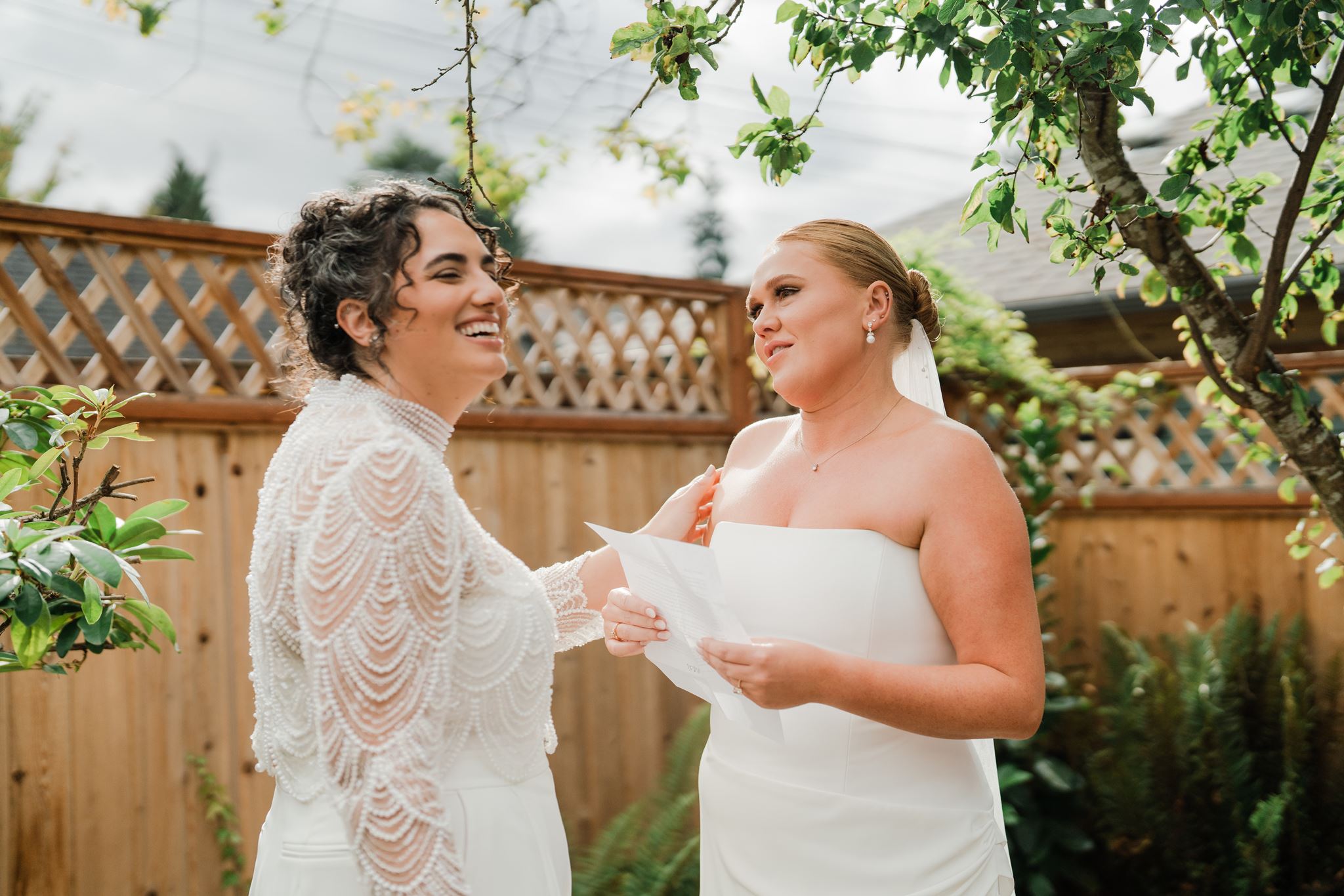 Brides Sharing Heartfelt Vows in Garden