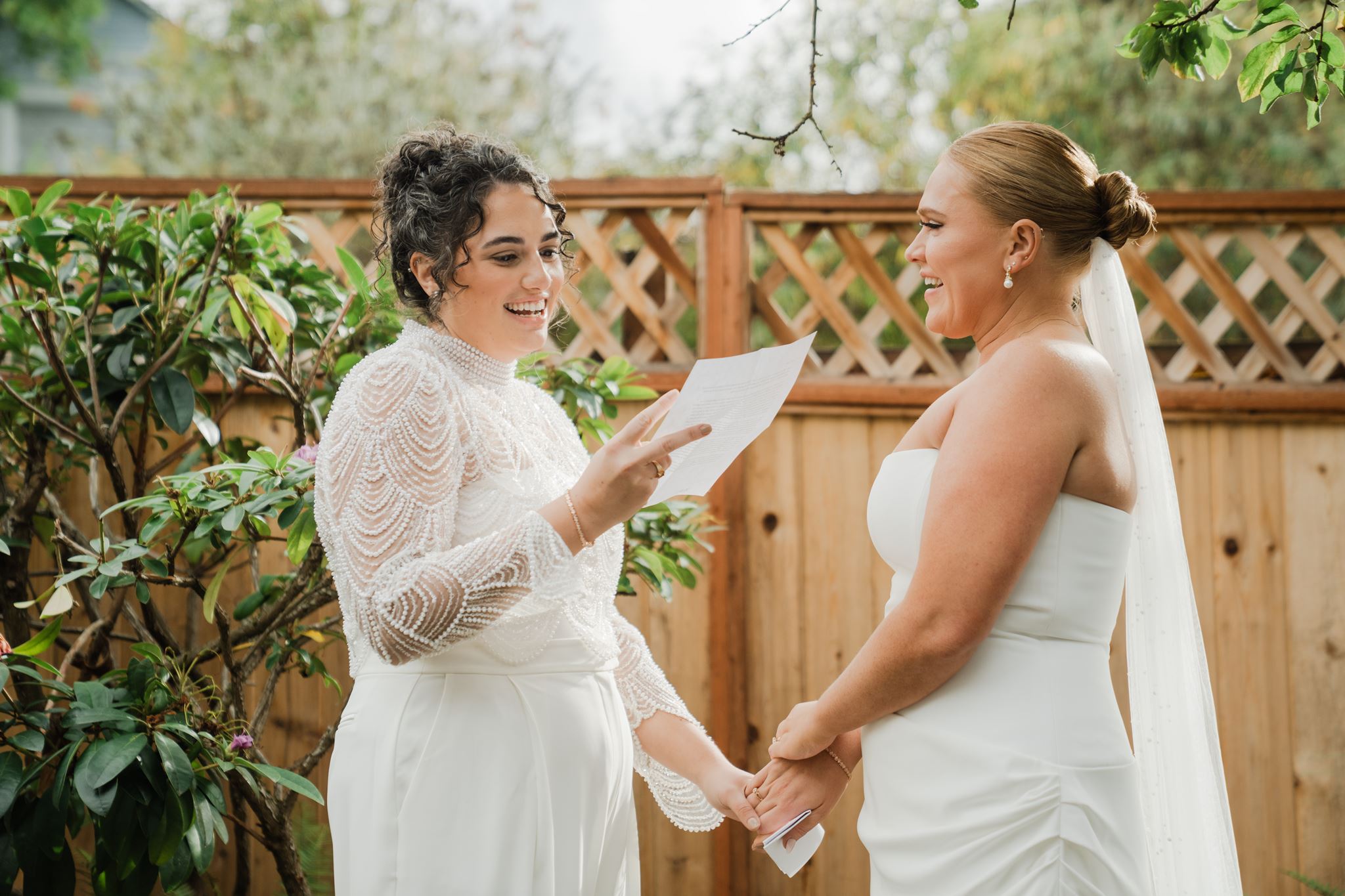 Brides Laughing While Exchanging Personal Vows Before Wedding