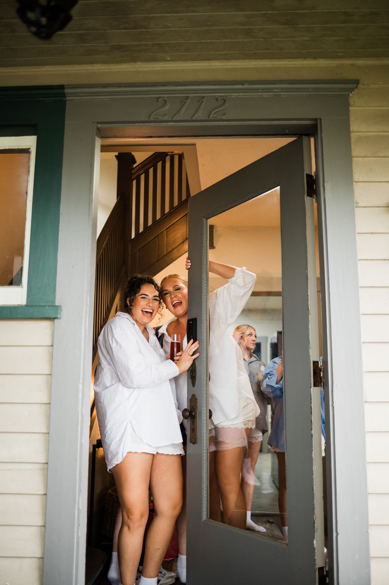 Brides Opening Door to Airbnb Together