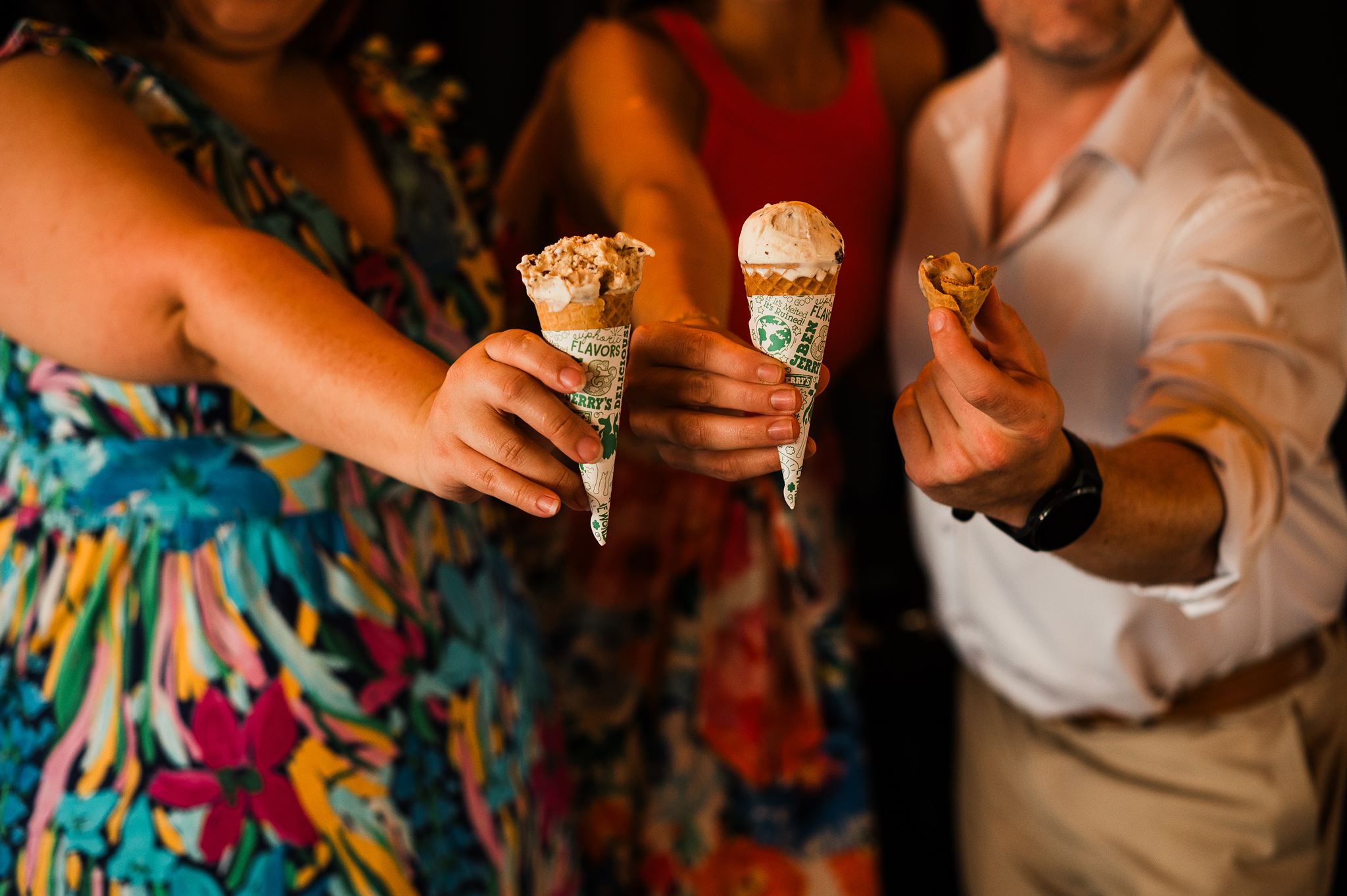 Guests Hold up Ice Cream Cones at Wedding