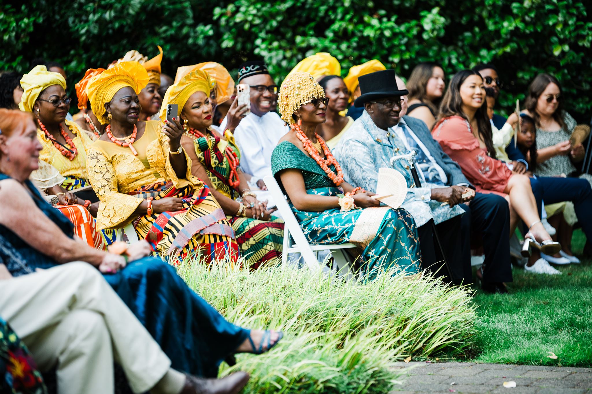 Wedding Guests Dressed in Traditional Nigerian Attire, Look on as Bride and Groom Exchange Vows