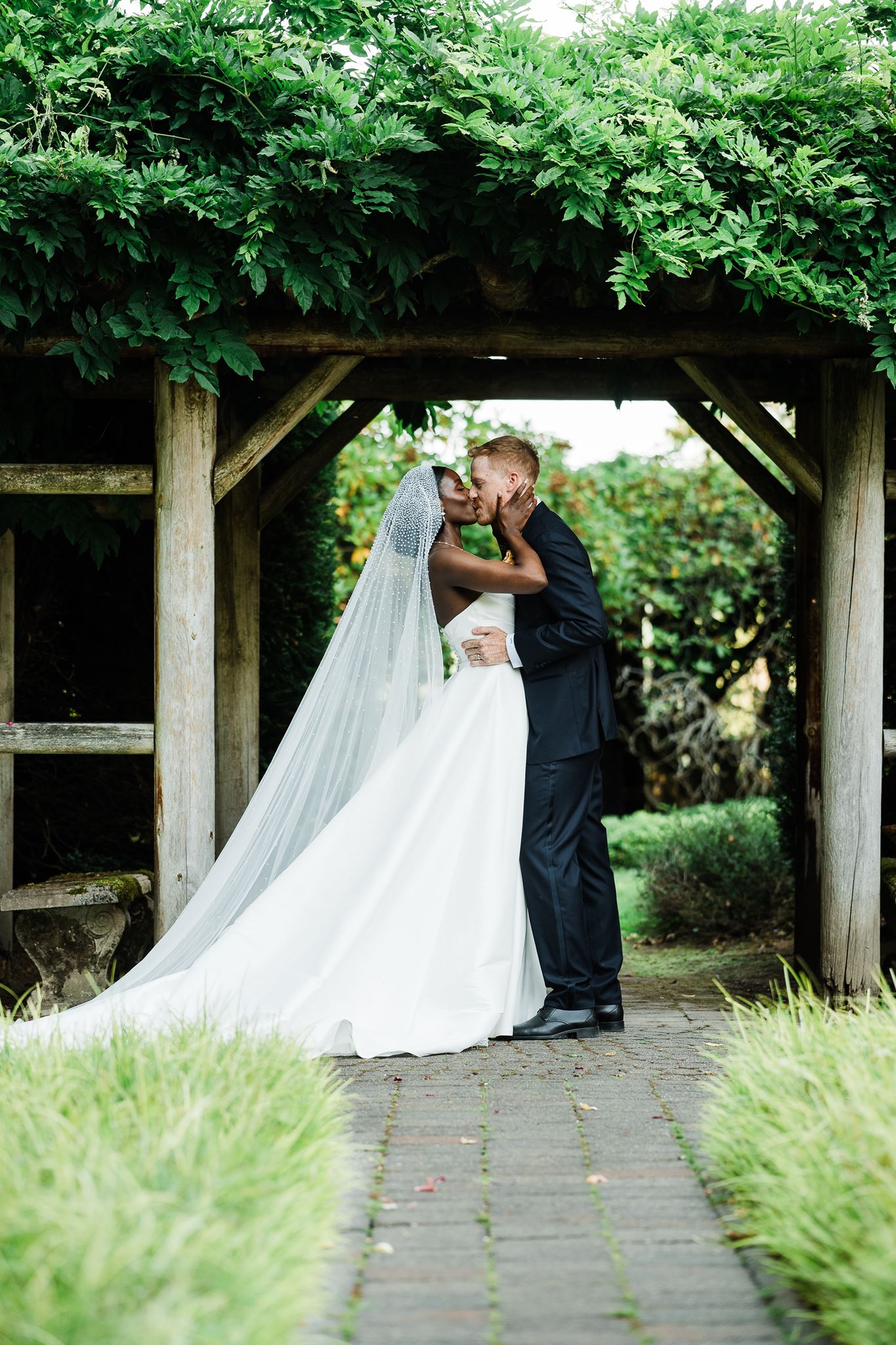 Bride and Groom Kiss After Being Pronounced Married at Carnation Farms