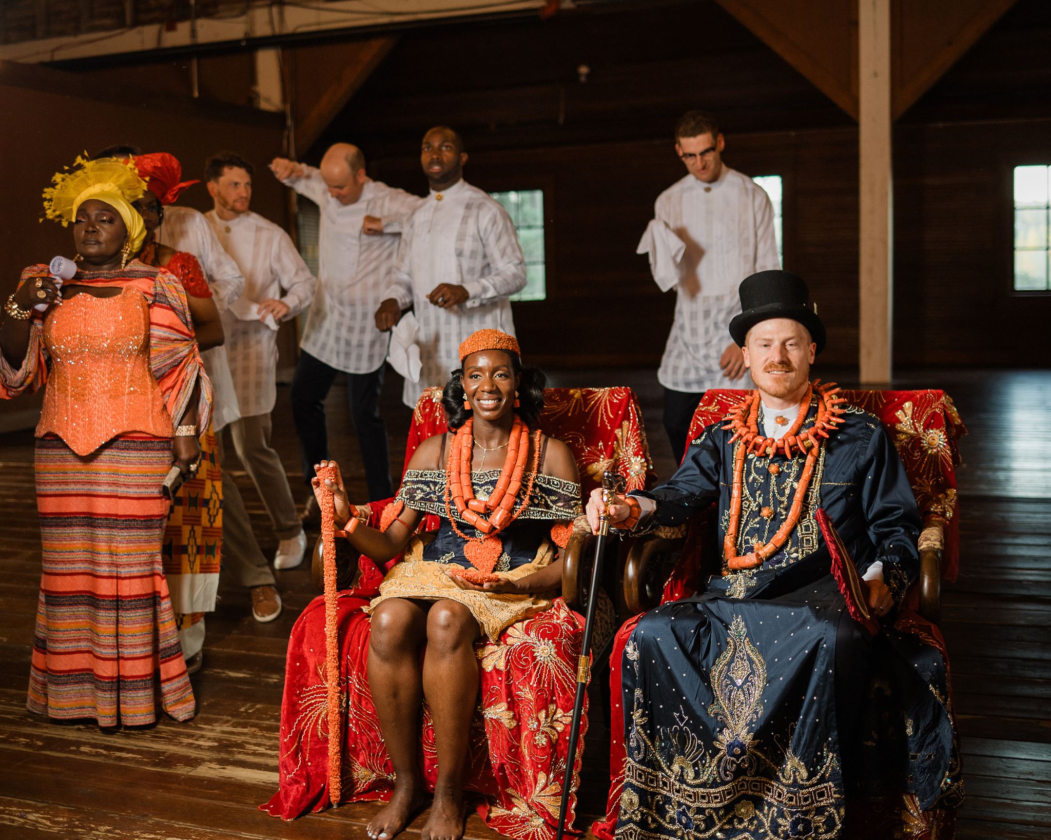 Bride and Groom sit in Traditional, Nigerian, Throne Chairs at Wedding