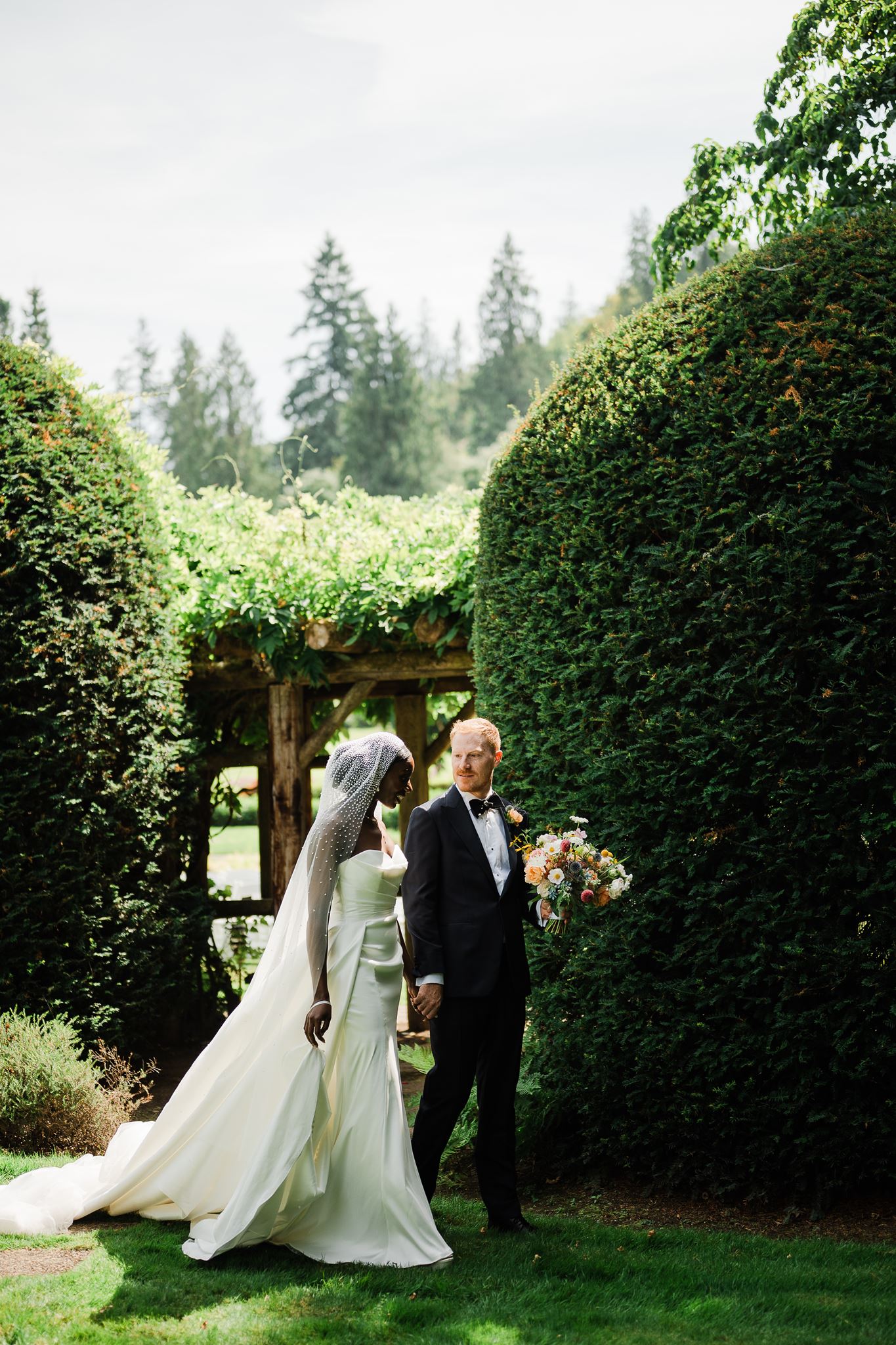 Bride and Groom Walk Away from Wedding Ceremony Together at Carnation Farms