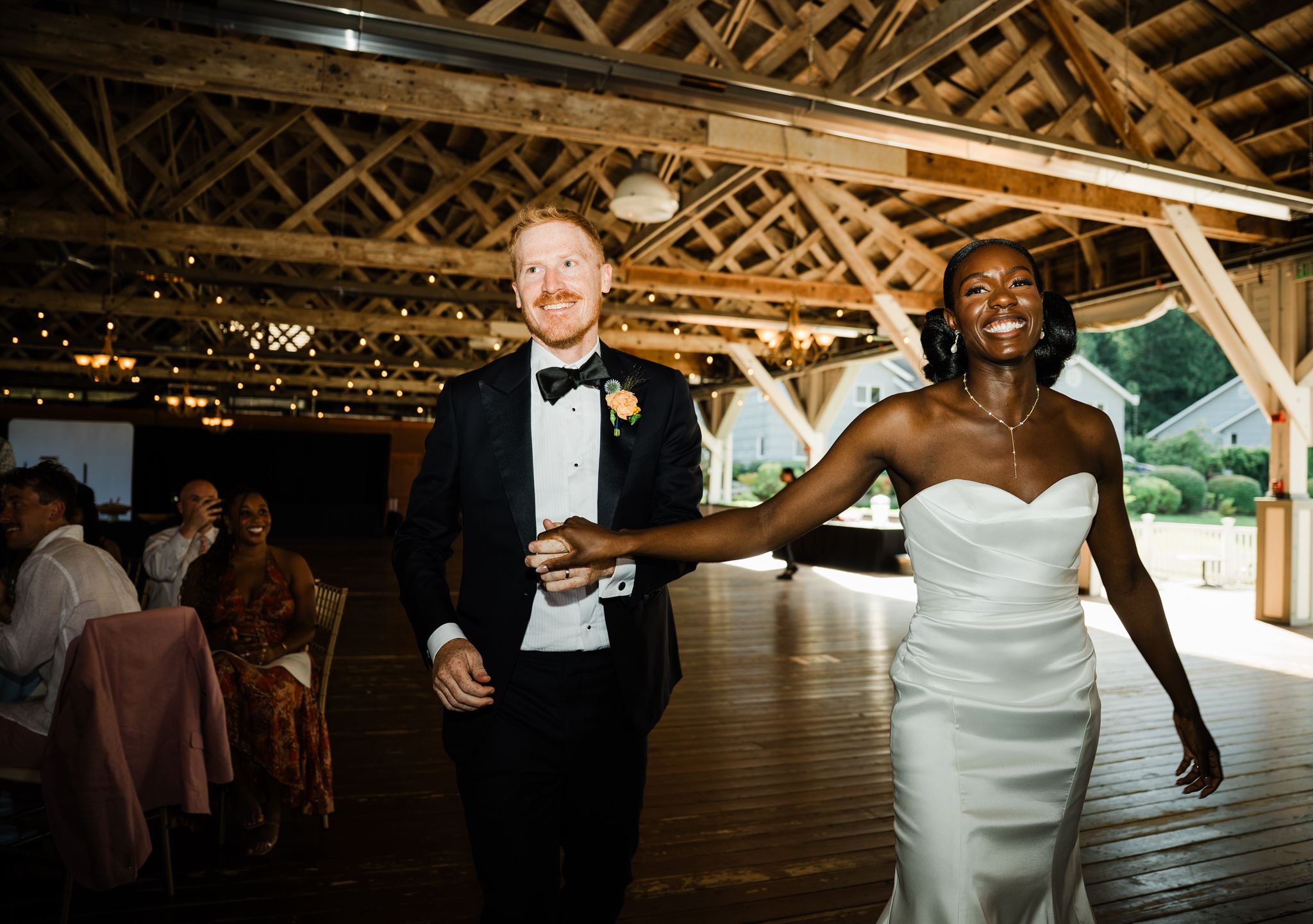 Bride and Groom Enter Wedding Reception Together, Smiling, Holding Hands